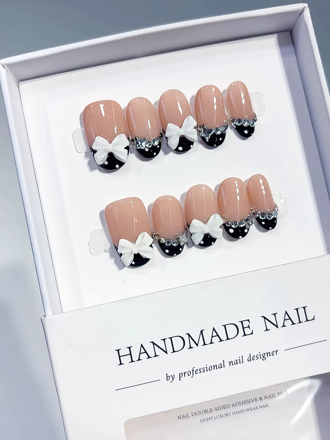 C452 - Medium Nude Black Oval French tip Bow Rhinestone VibeNailsLab