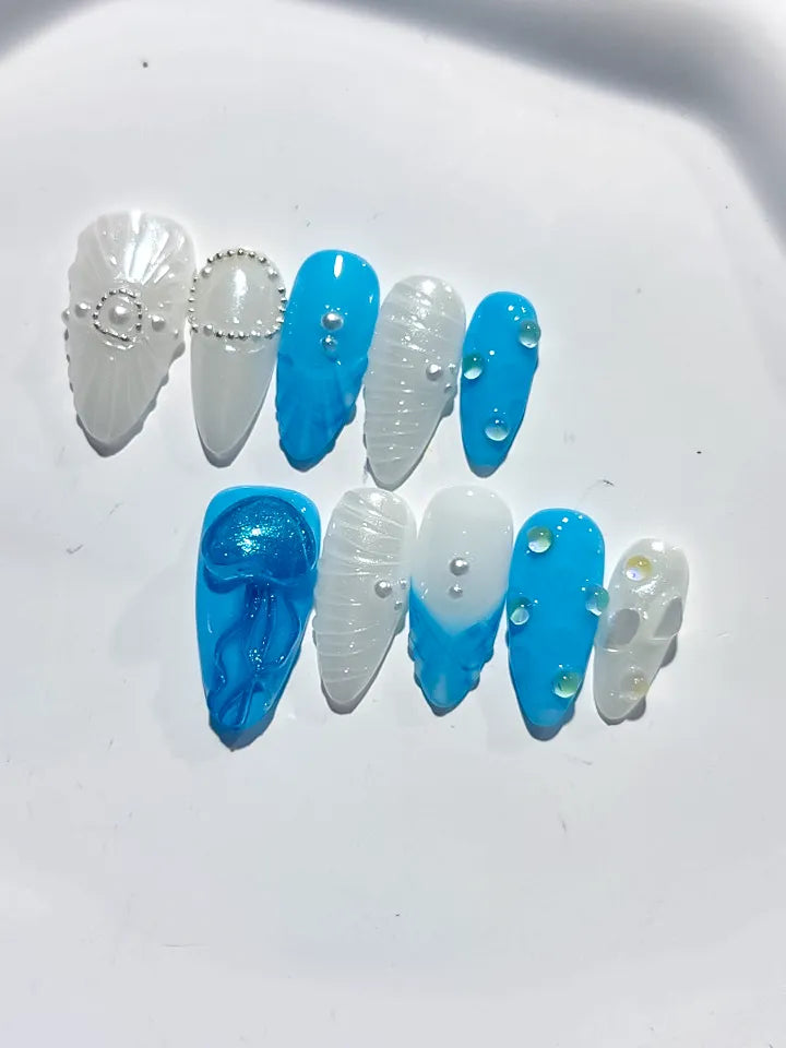 D387 - Medium Blue White Almond Abstract Bow Pearl VibeNailsLab