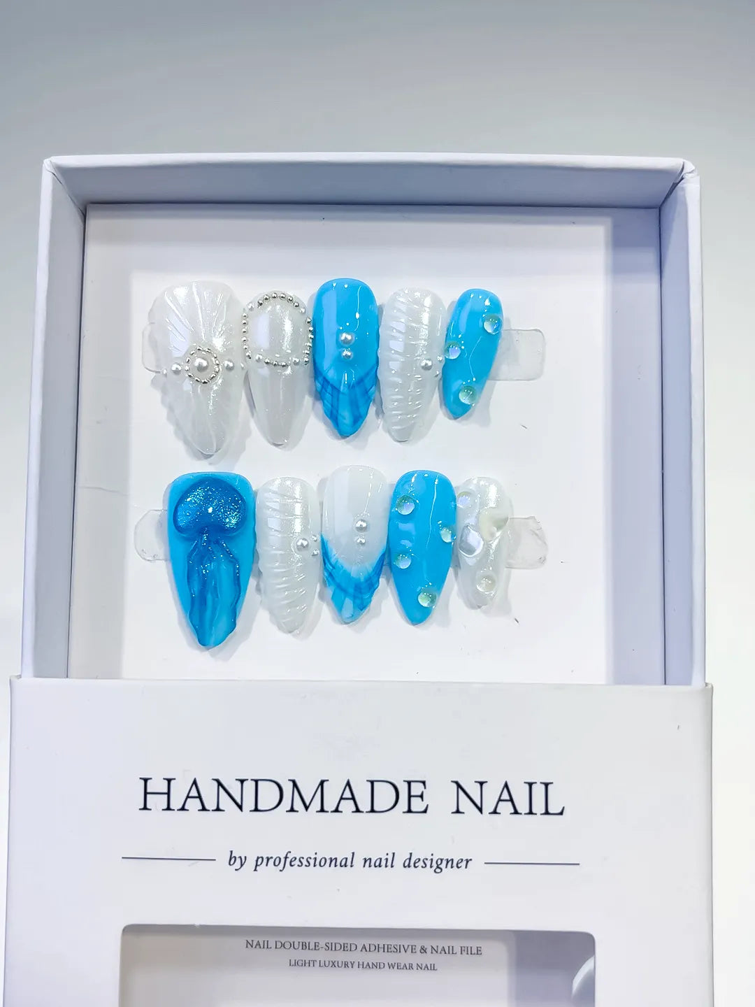 D387 - Medium Blue White Almond Abstract Bow Pearl VibeNailsLab