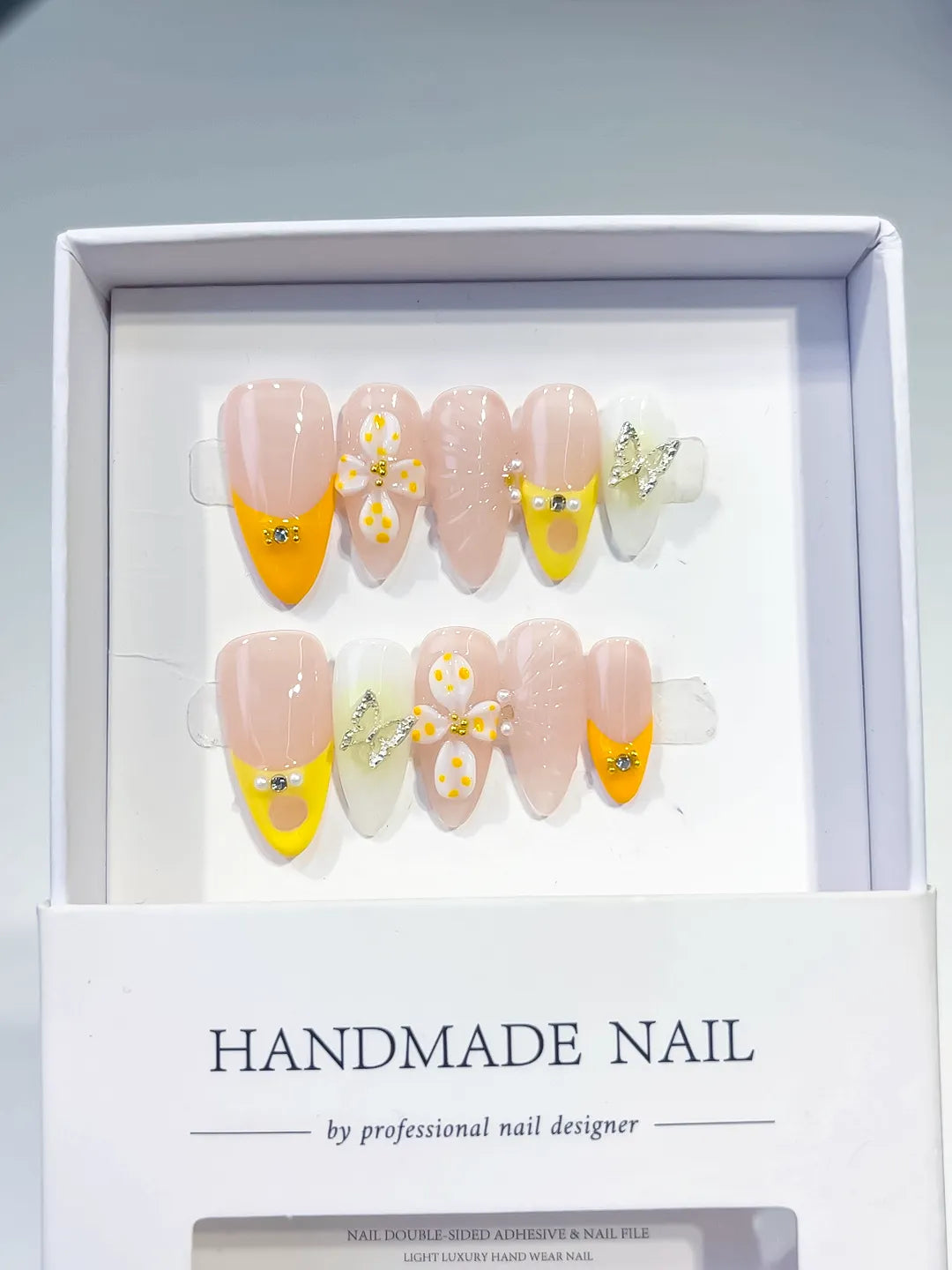 D428 - Medium Nude Yellow Almond French tip Flower Metallic Charm