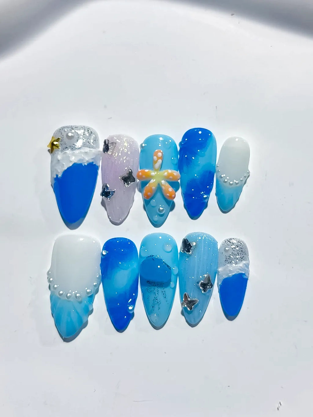 D434 - Medium Blue White Almond Glitter Flower Star