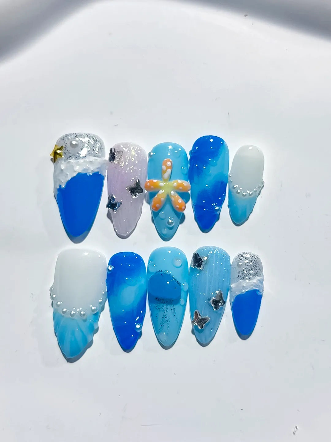 D434 - Medium Blue White Almond Glitter Flower Star