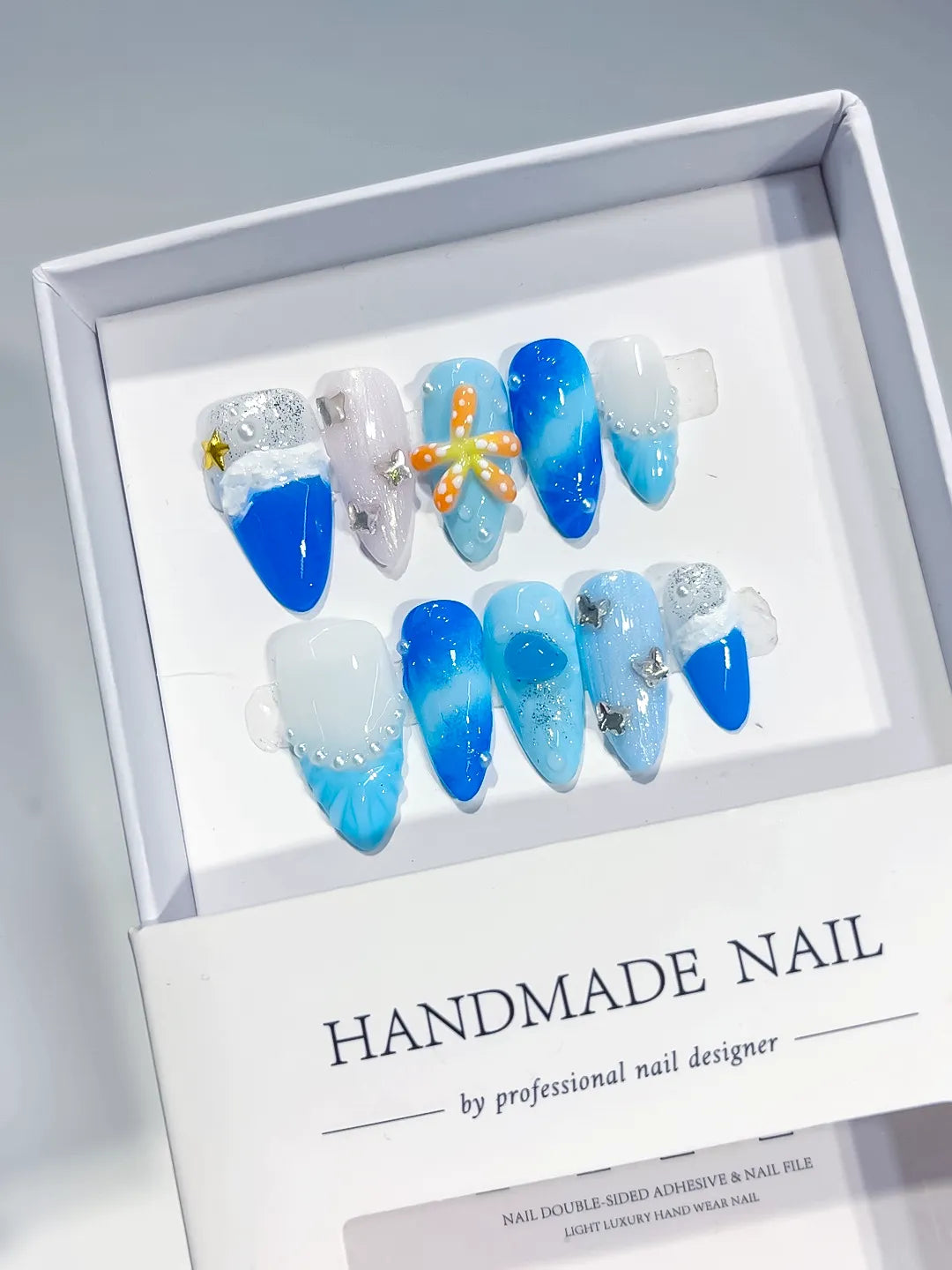 D434 - Medium Blue White Almond Glitter Flower Star
