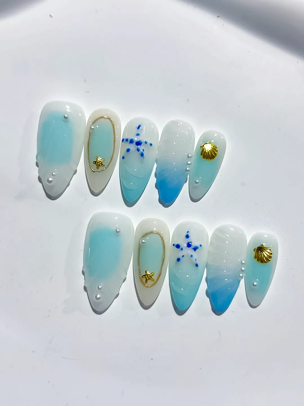 D438 - Medium White Blue Almond Ombre Star Shell