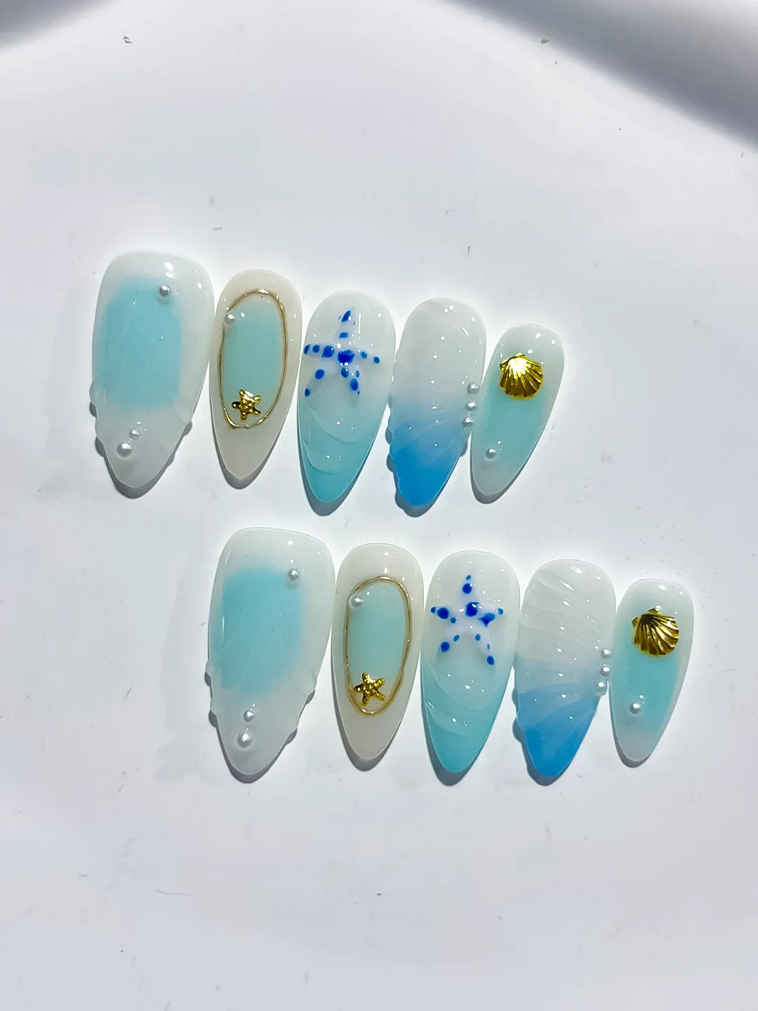 D438 - Medium White Blue Almond Ombre Star Shell