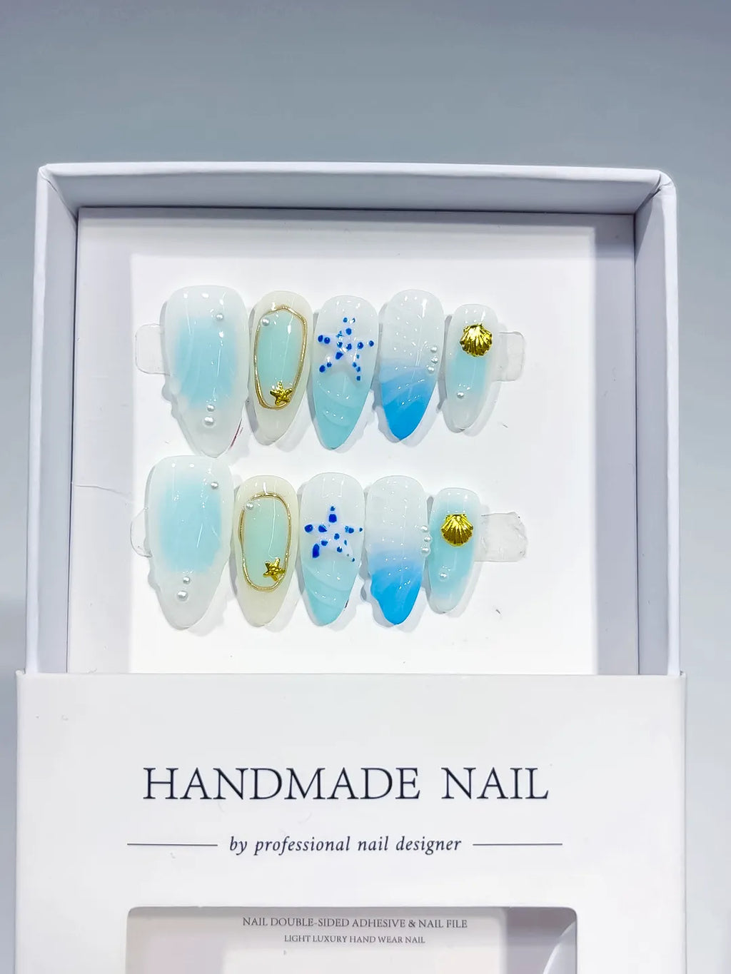 D438 - Medium White Blue Almond Ombre Star Shell