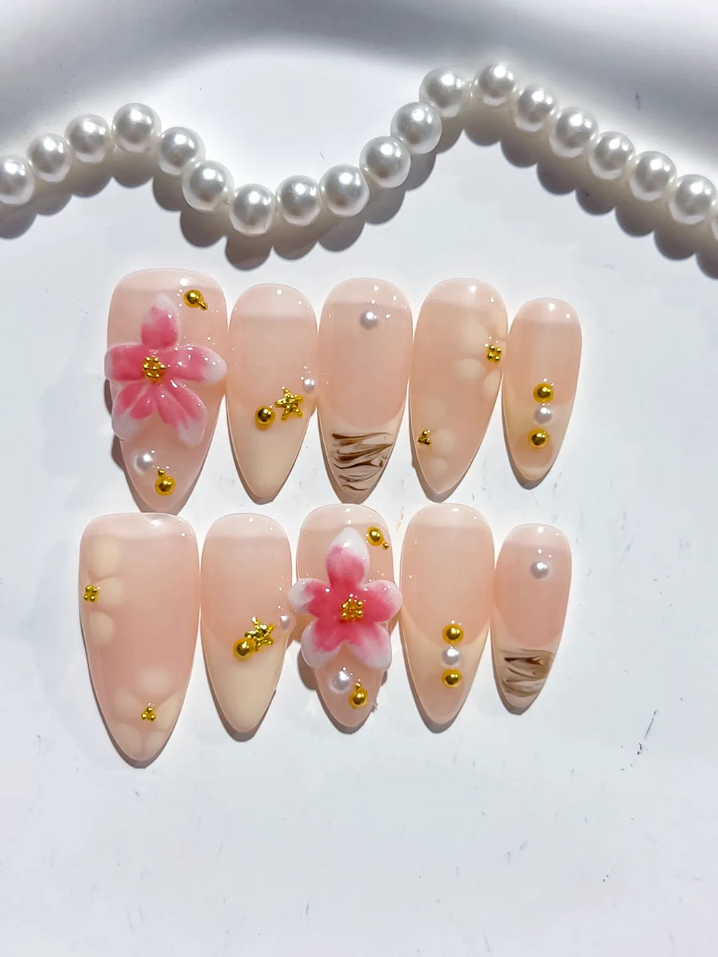 D479 - Medium Nude Pink Almond Solid color Flower Metallic Charm