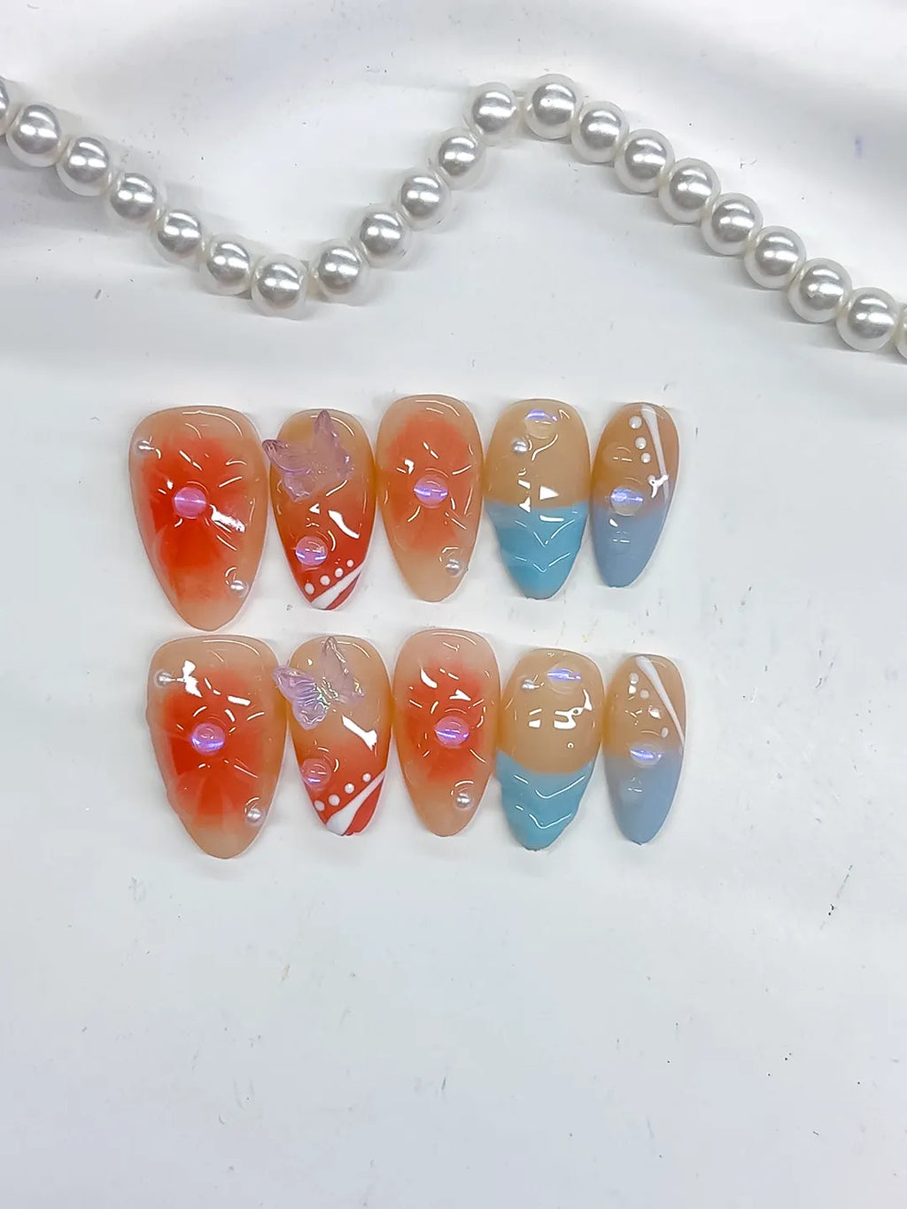 D506 - Short Nude Orange Almond Abstract Flower Bow