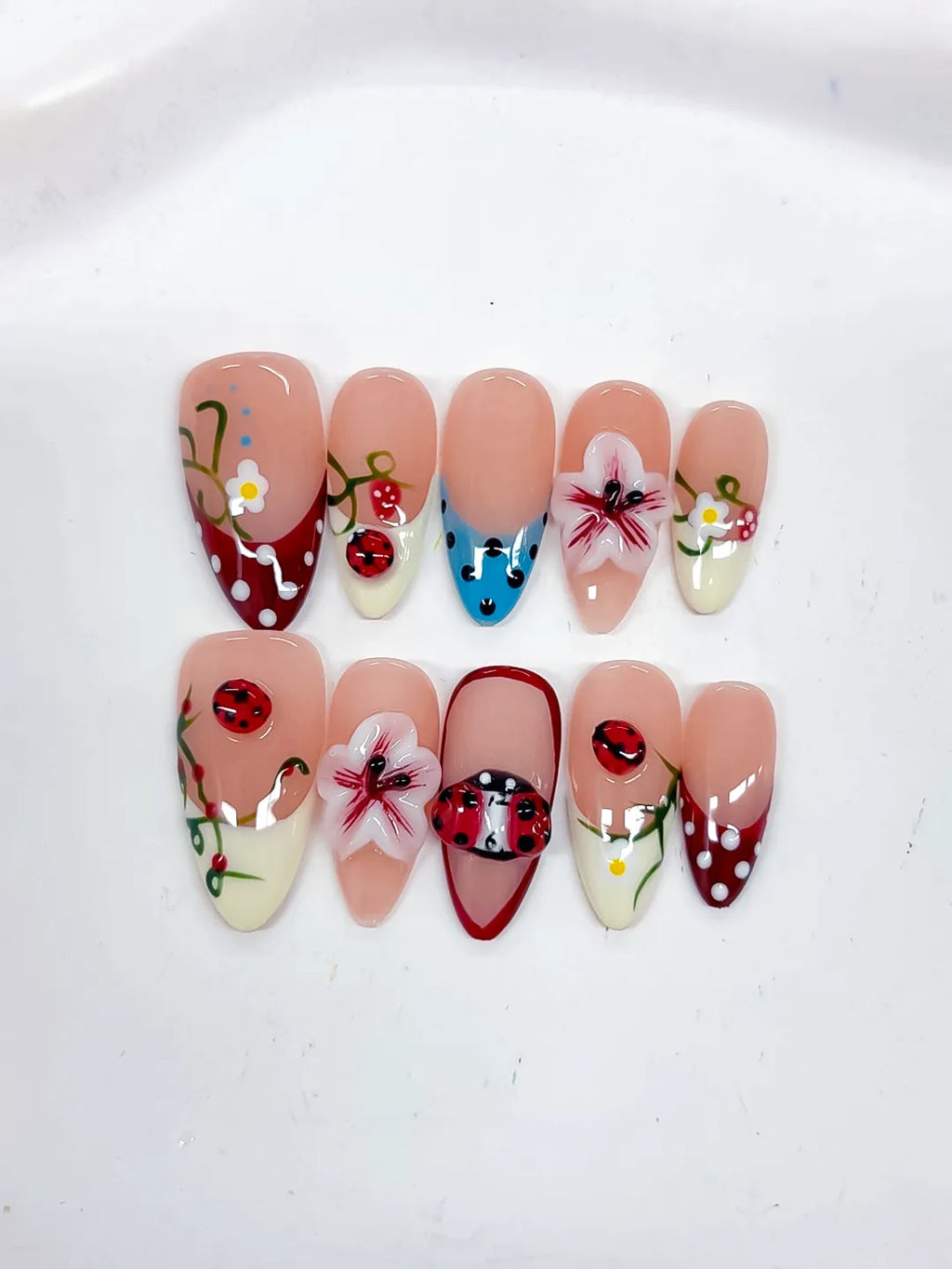 D522 - Medium Nude Red Almond Abstract Flower Ladybug