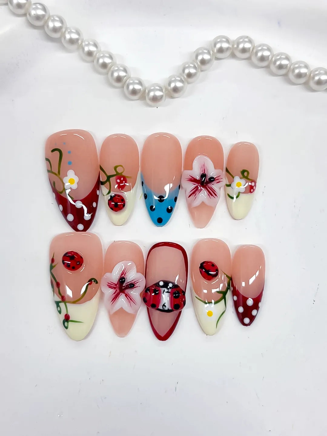 D522 - Medium Nude Red Almond Abstract Flower Ladybug