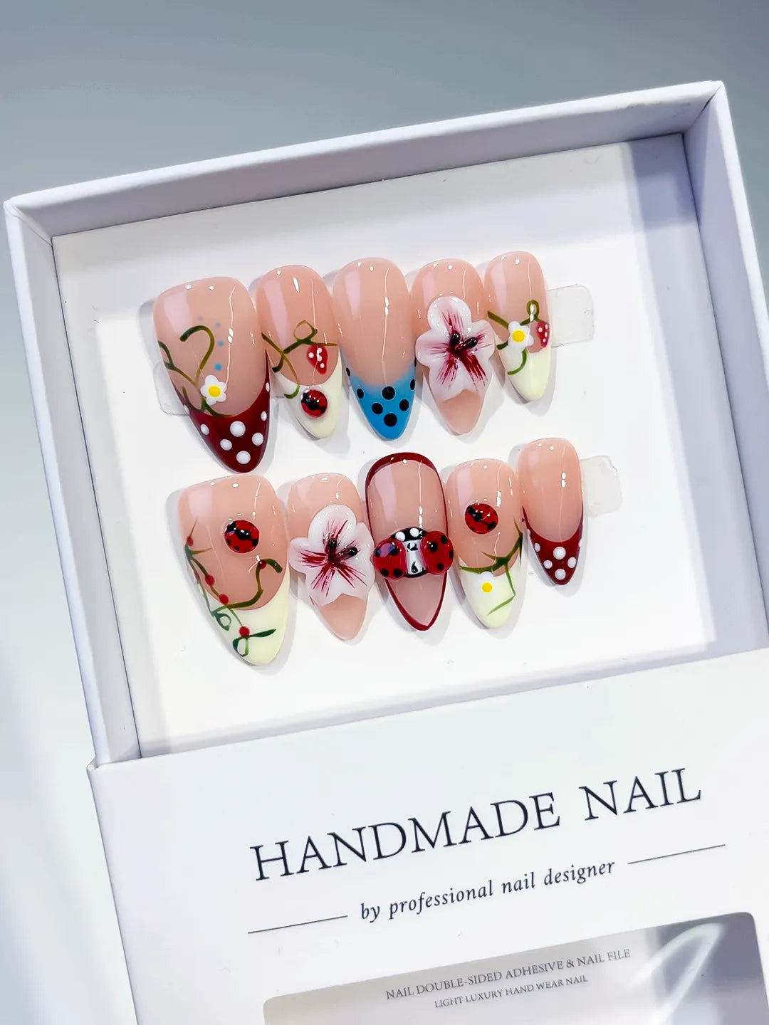 D522 - Medium Nude Red Almond Abstract Flower Ladybug