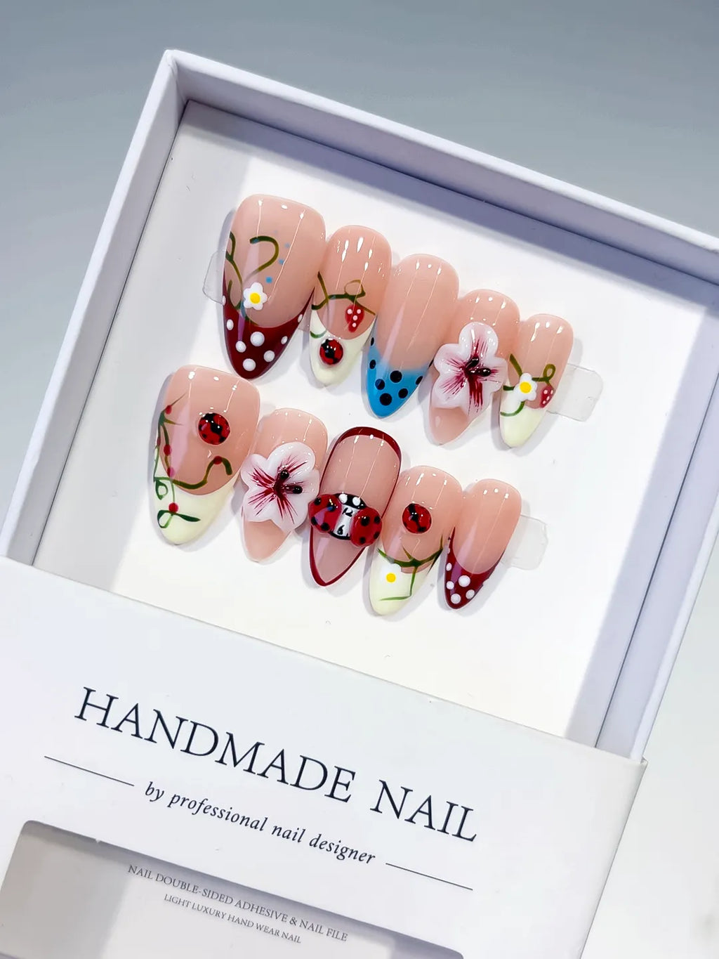D522 - Medium Nude Red Almond Abstract Flower Ladybug