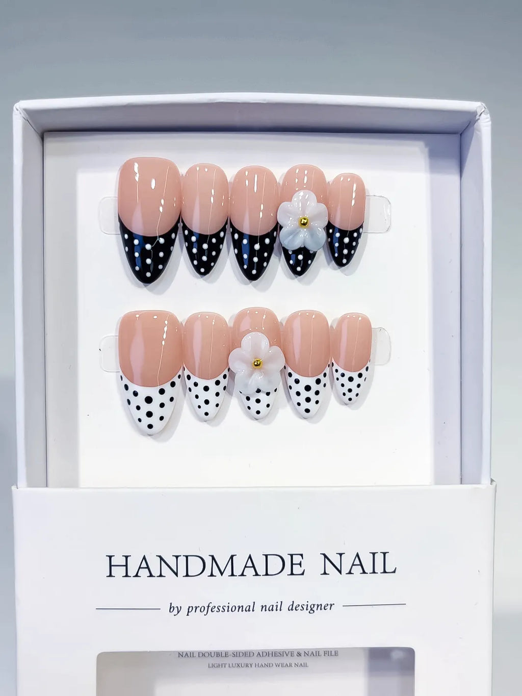 D557 - Medium Nude Black Almond French tip Flower Dot Pattern