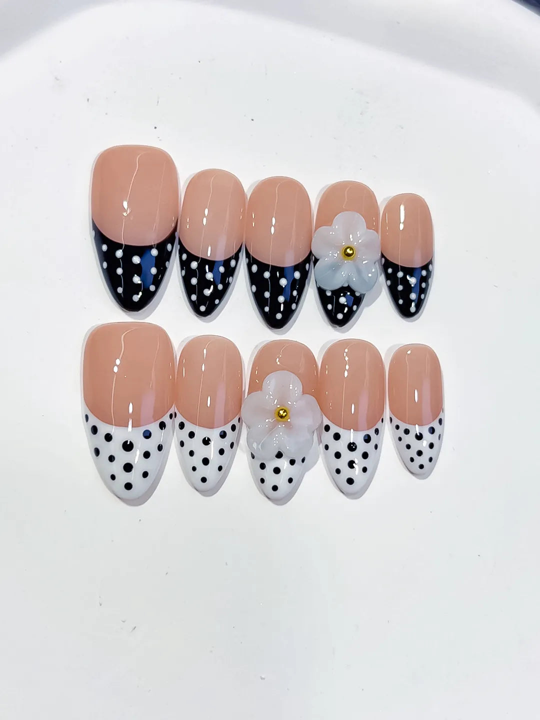 D557 - Medium Nude Black Almond French tip Flower Dot Pattern