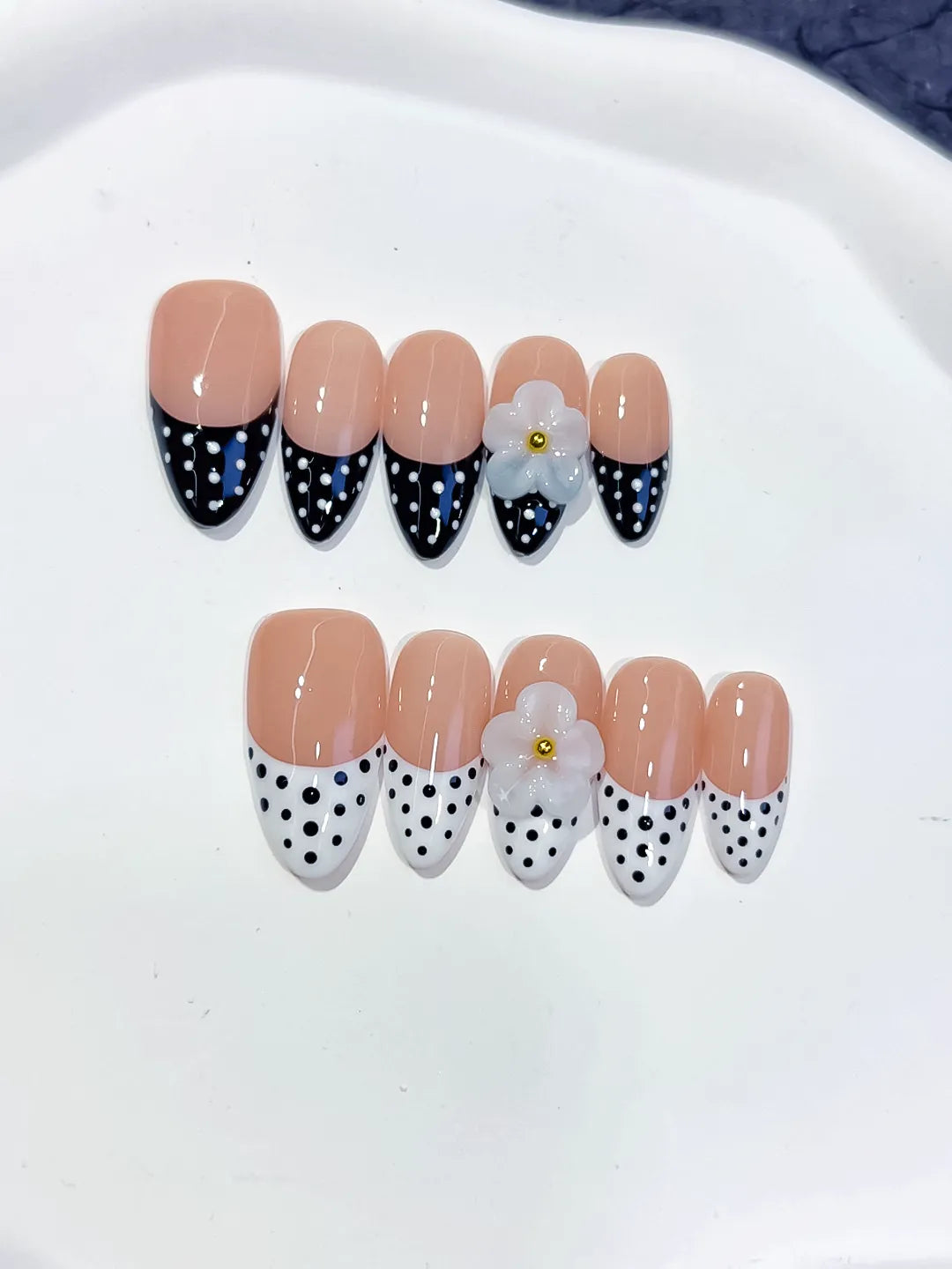 D557 - Medium Nude Black Almond French tip Flower Dot Pattern