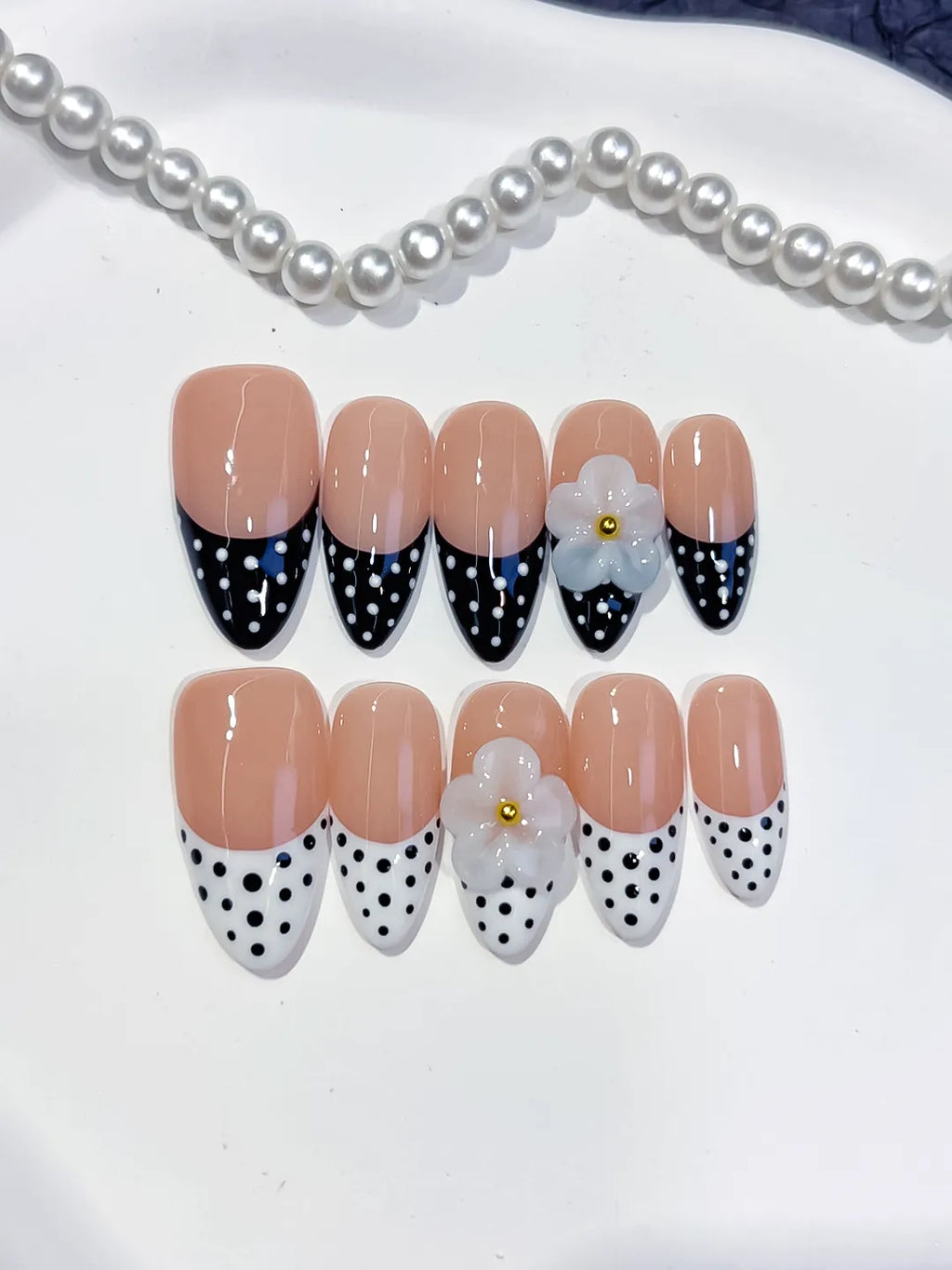 D557 - Medium Nude Black Almond French tip Flower Dot Pattern
