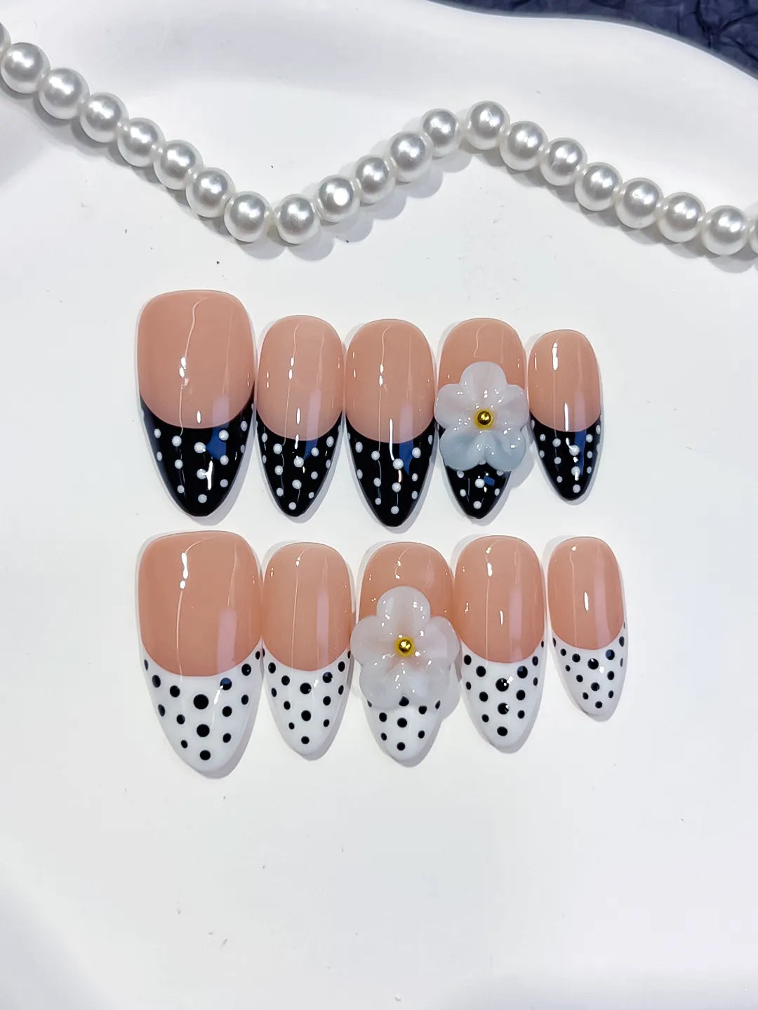 D557 - Medium Nude Black Almond French tip Flower Dot Pattern