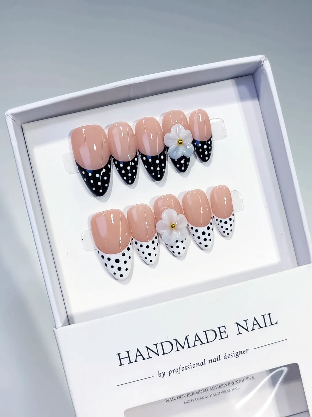 D557 - Medium Nude Black Almond French tip Flower Dot Pattern