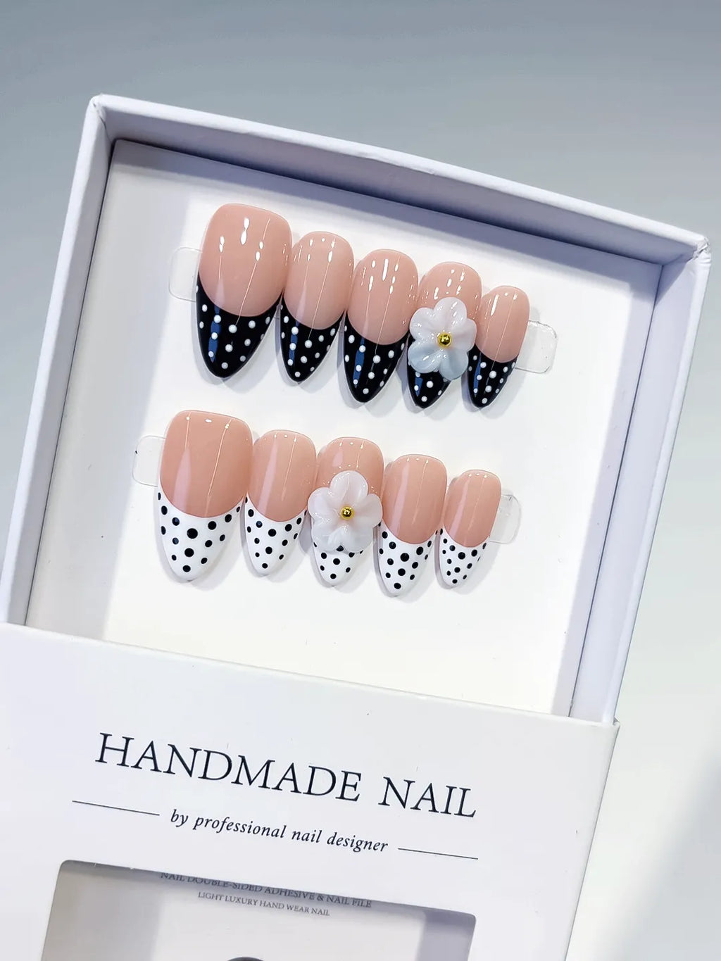 D557 - Medium Nude Black Almond French tip Flower Dot Pattern
