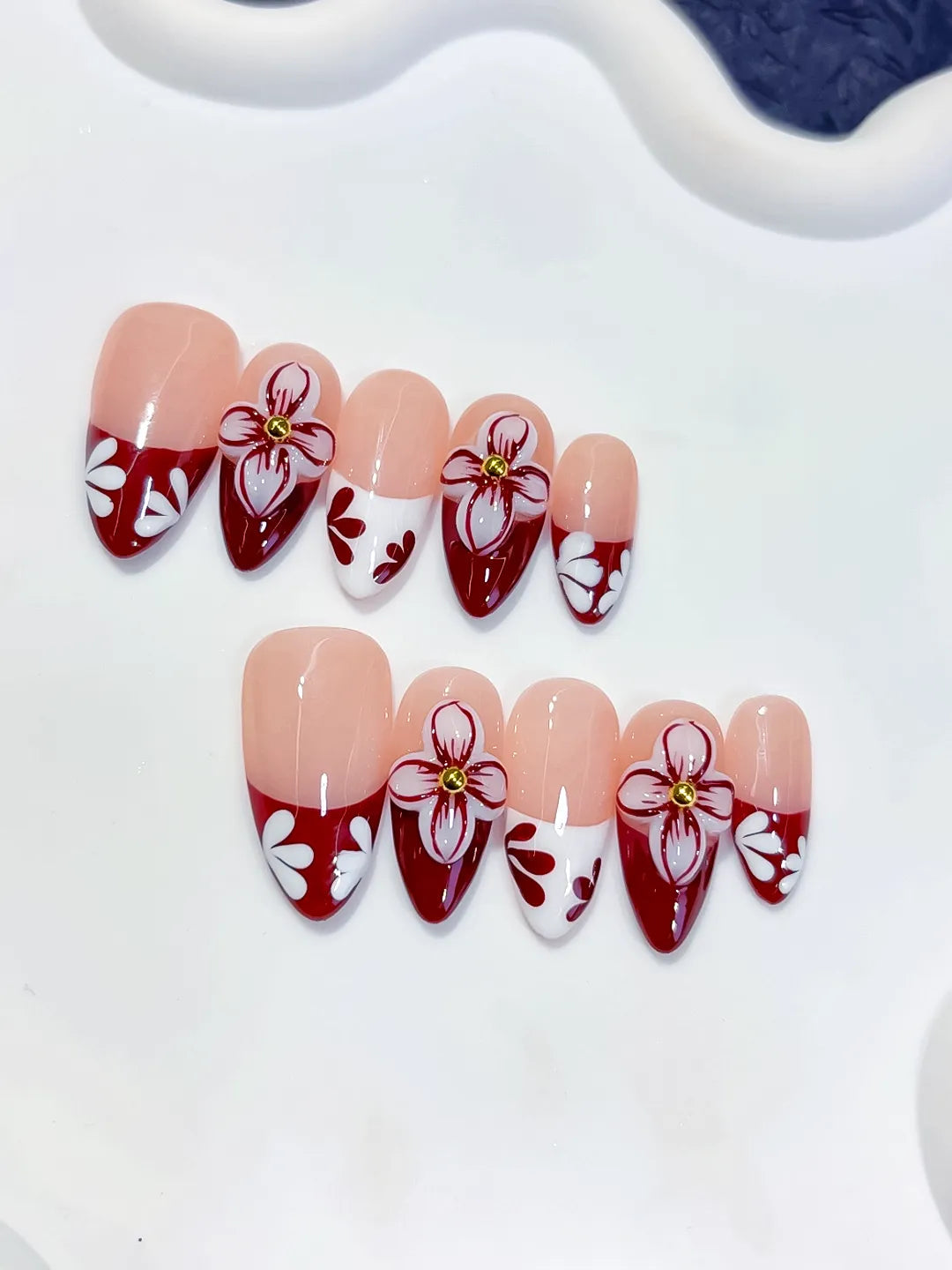 D606 - Medium Nude Red Almond French tip Flower VibeNailsLab