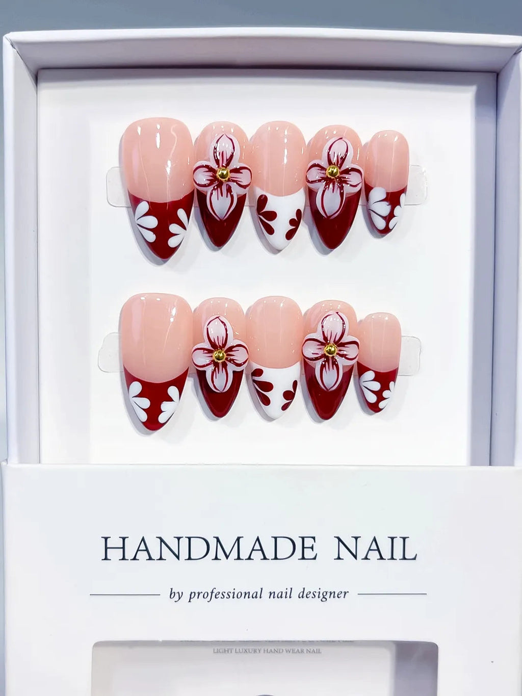 D606 - Medium Nude Red Almond French tip Flower VibeNailsLab