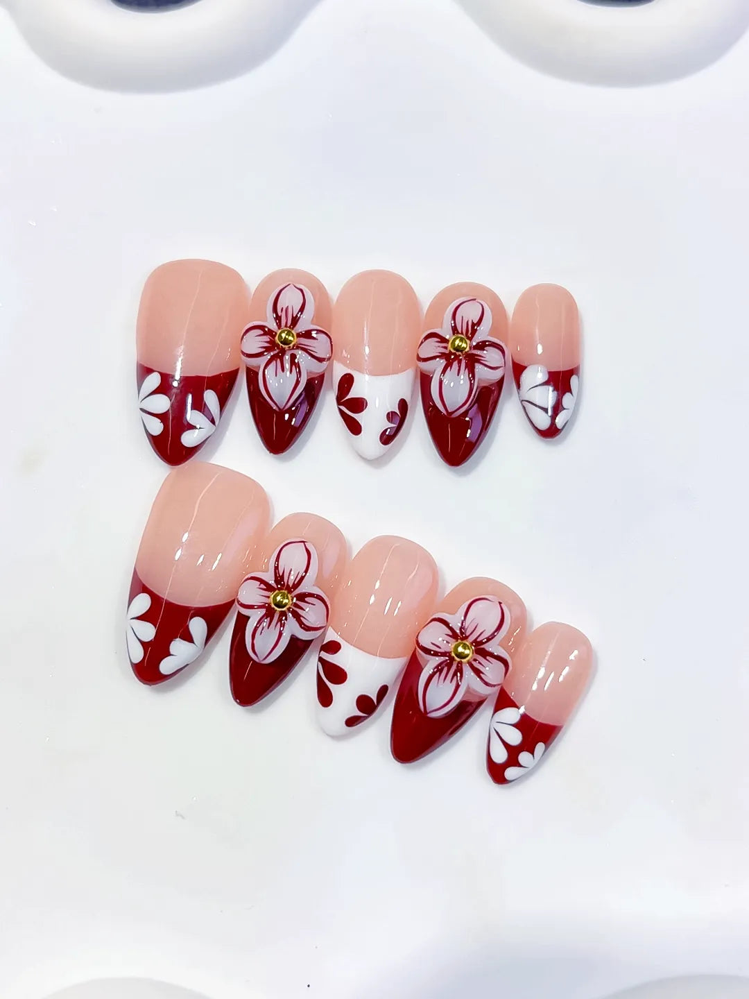 D606 - Medium Nude Red Almond French tip Flower VibeNailsLab