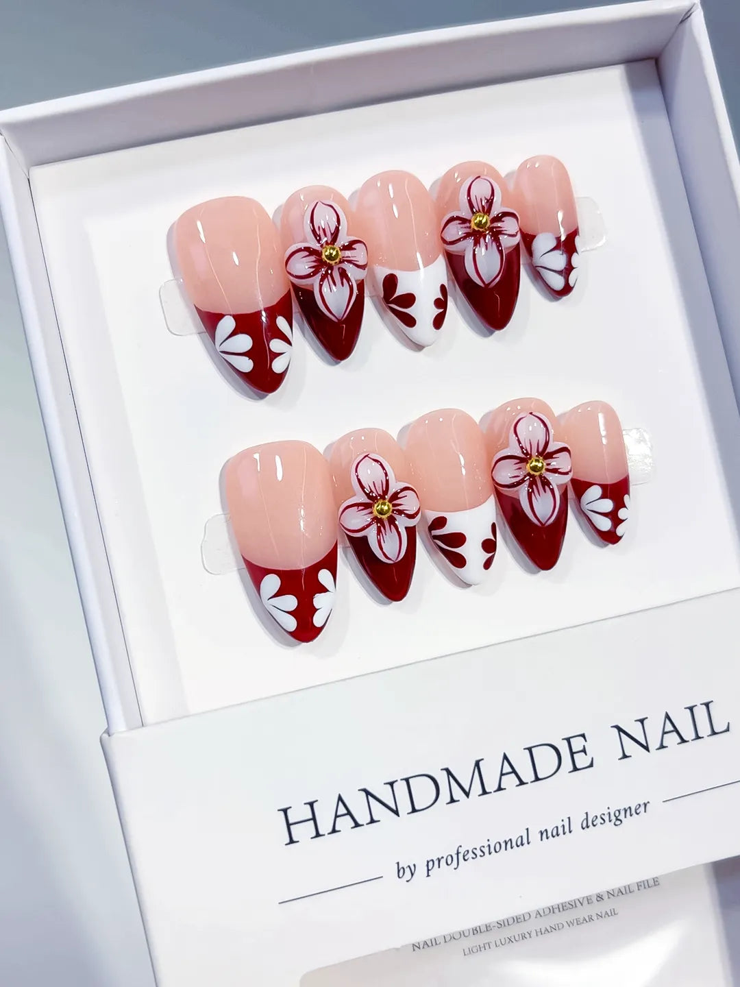 D606 - Medium Nude Red Almond French tip Flower VibeNailsLab