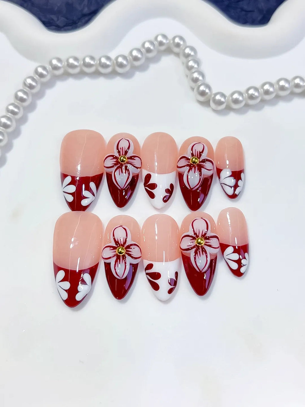 D606 - Medium Nude Red Almond French tip Flower VibeNailsLab