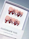 D606 - Medium Nude Red Almond French tip Flower VibeNailsLab
