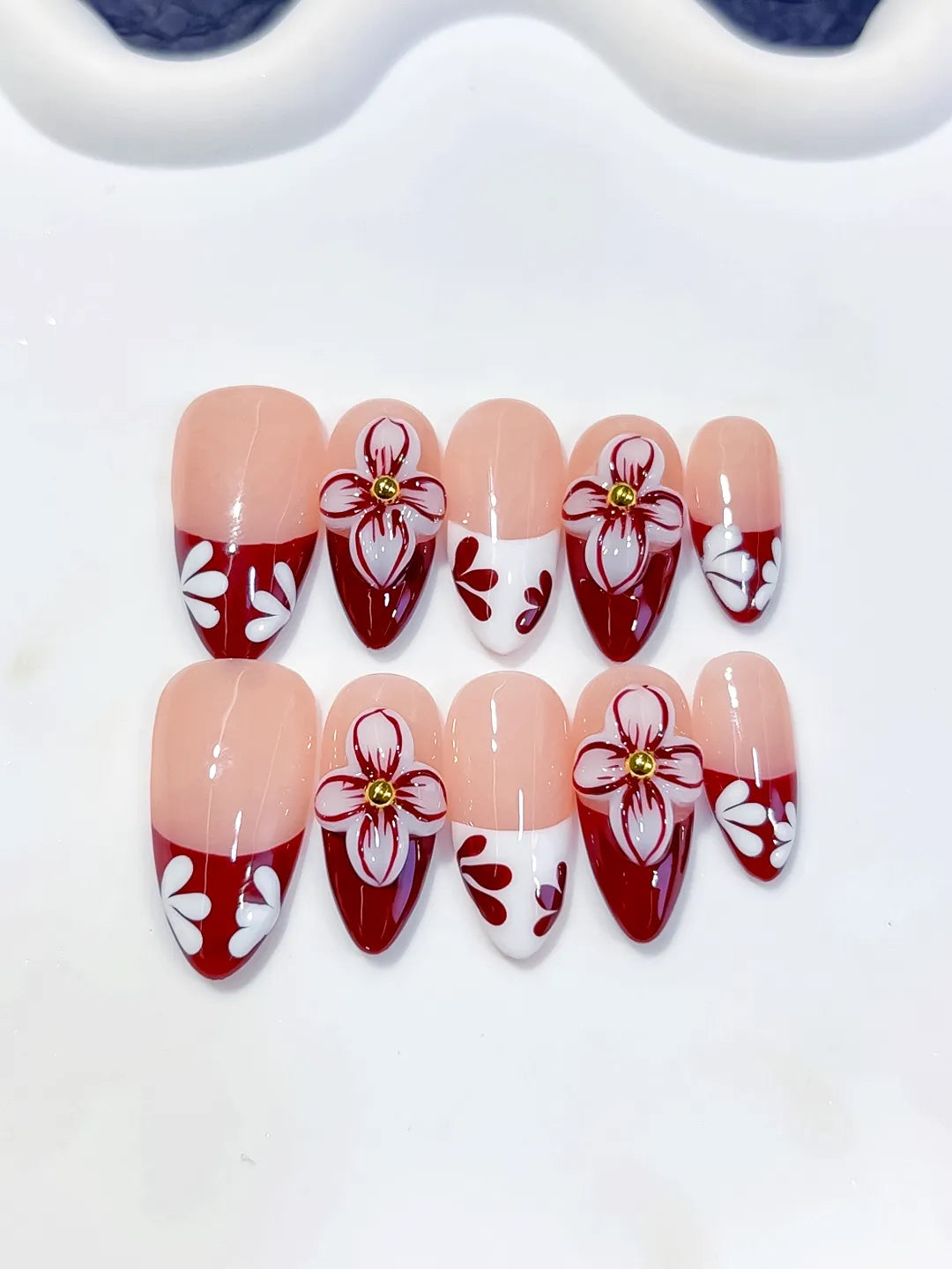 D606 - Medium Nude Red Almond French tip Flower VibeNailsLab