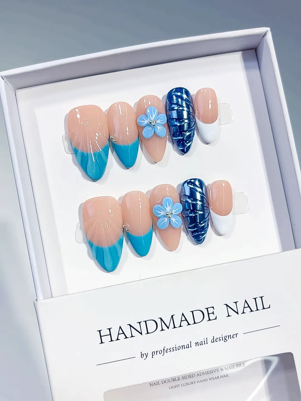 D613 - Medium Nude Blue Almond French tip Flower Cat Eye VibeNailsLab