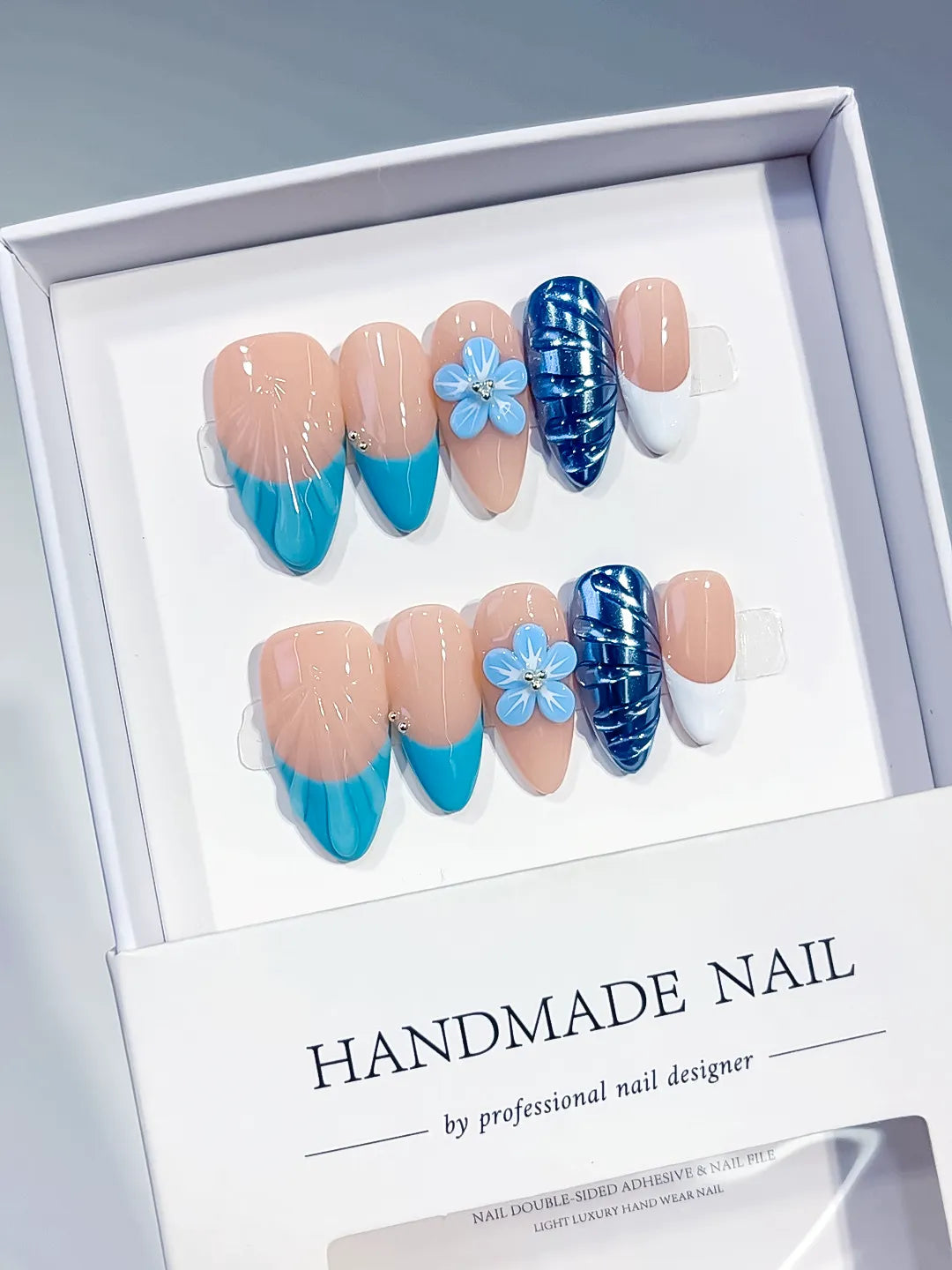 D613 - Medium Nude Blue Almond French tip Flower Cat Eye VibeNailsLab