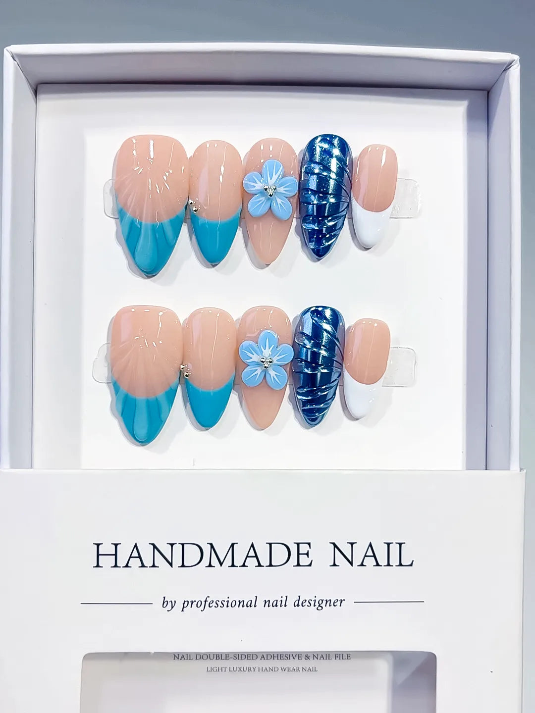 D613 - Medium Nude Blue Almond French tip Flower Cat Eye VibeNailsLab