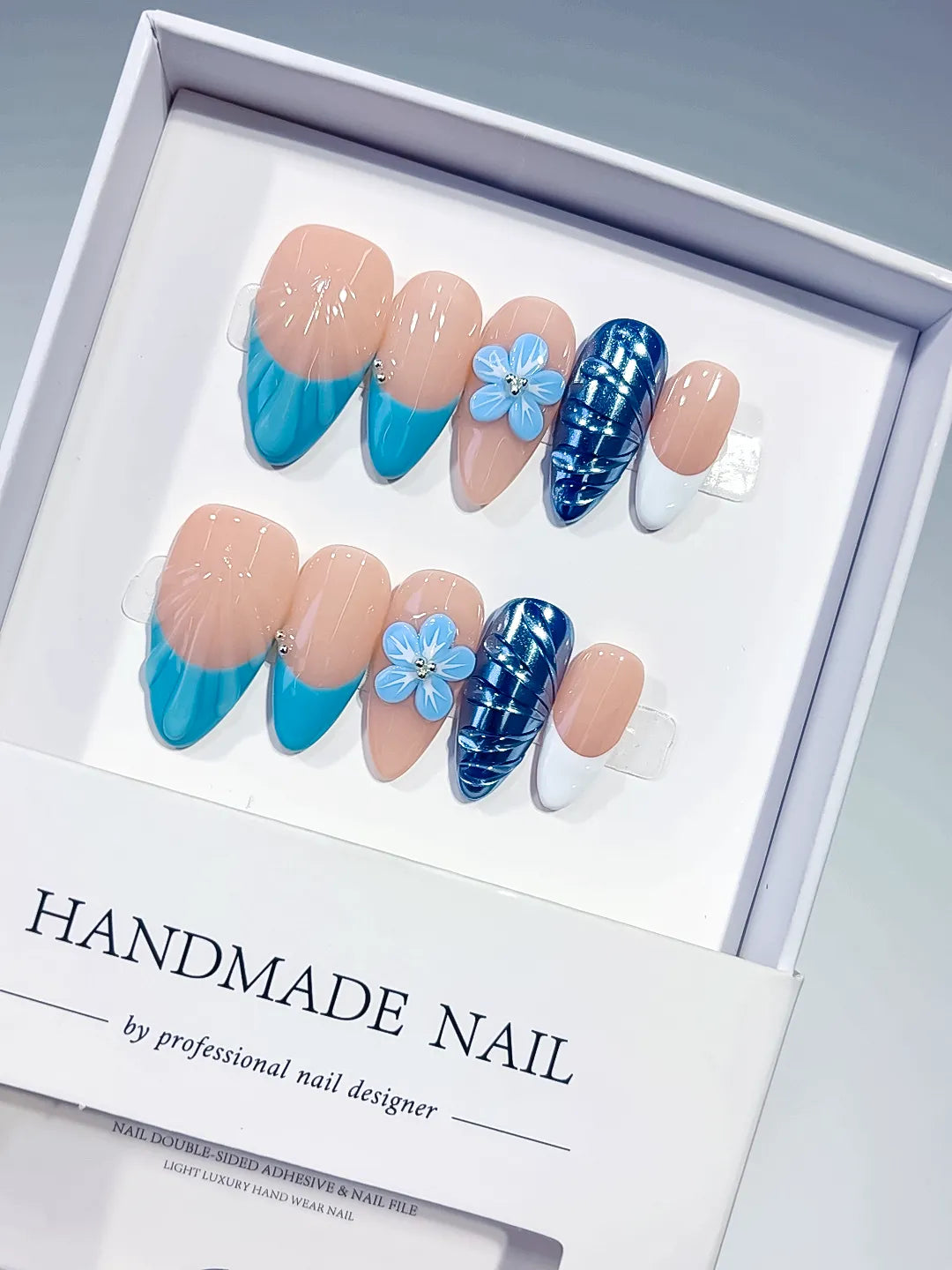 D613 - Medium Nude Blue Almond French tip Flower Cat Eye VibeNailsLab