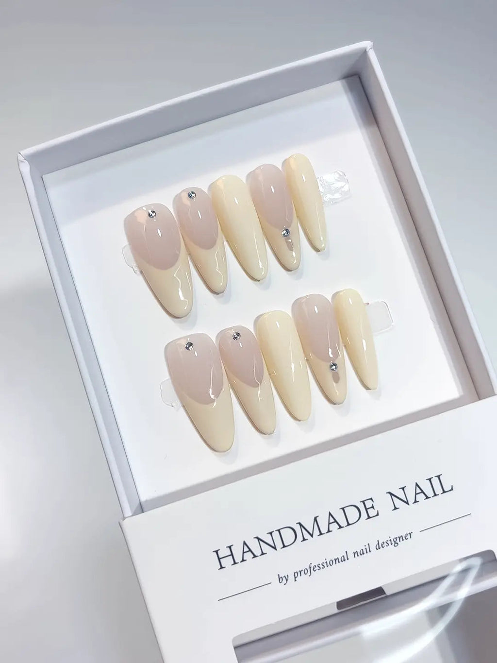 A071 - Long Nude Oval French tip Rhinestone VibeNailsLab