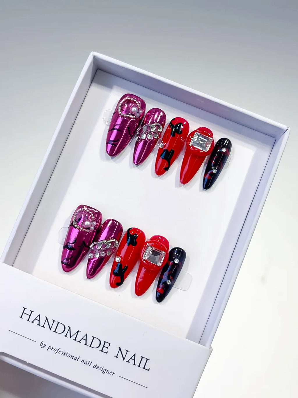 L032 - Long Pink Red Oval Metallic Bow Pearl