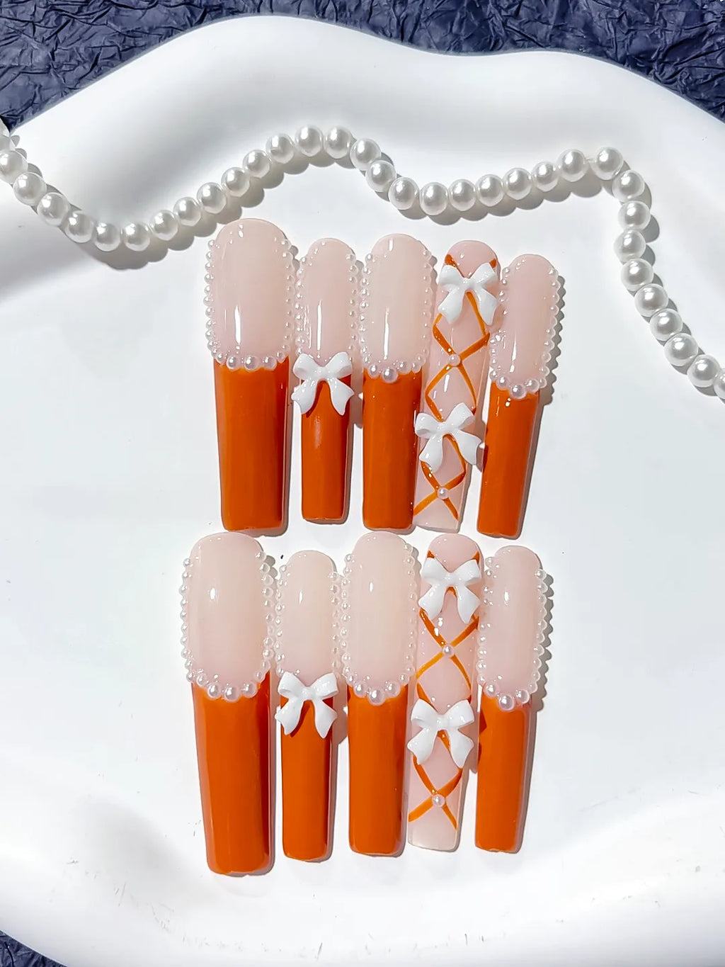 L094 - Long Nude Orange Square French tip Bow Pearl