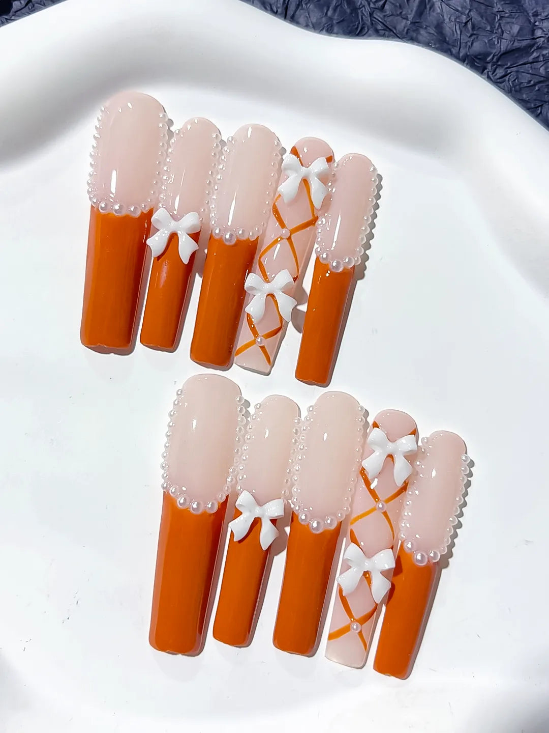 L094 - Long Nude Orange Square French tip Bow Pearl