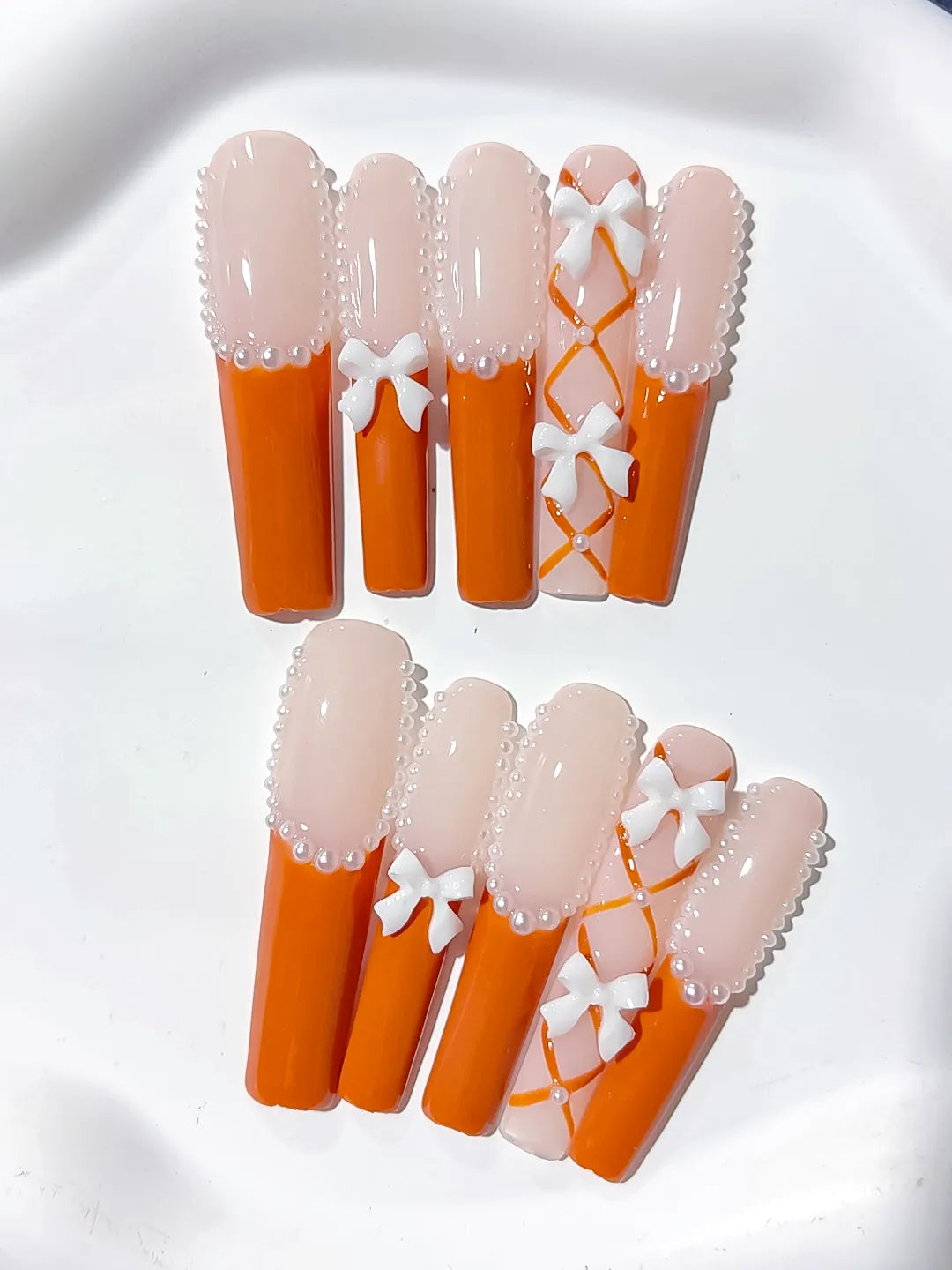 L094 - Long Nude Orange Square French tip Bow Pearl
