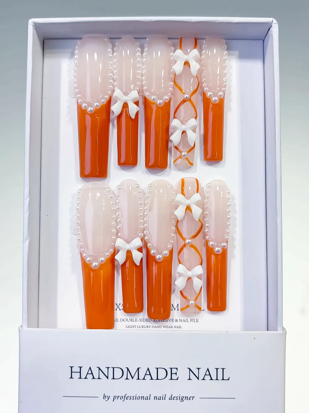 L094 - Long Nude Orange Square French tip Bow Pearl