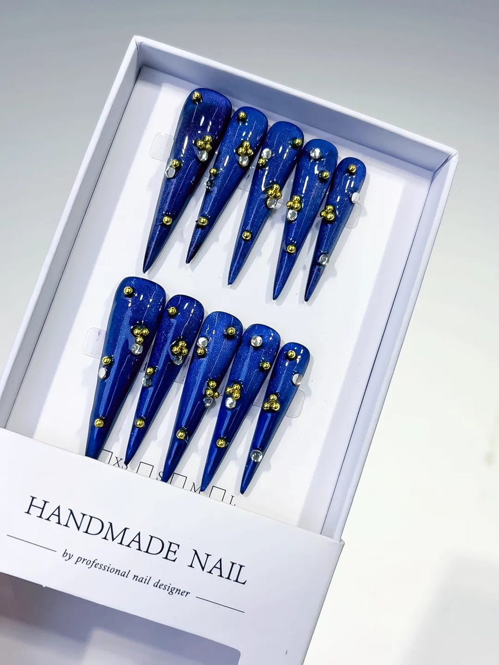 L136 - Long Blue Gold Stiletto Metallic Stud