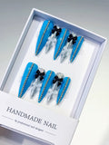 L146 - Long Blue Silver Stiletto Abstract Bow Glitter