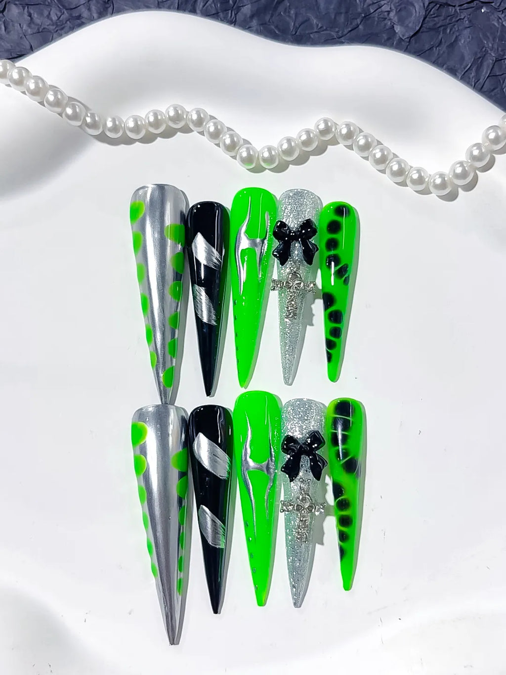 L152 - Long Silver Black Stiletto Abstract Bow Cross