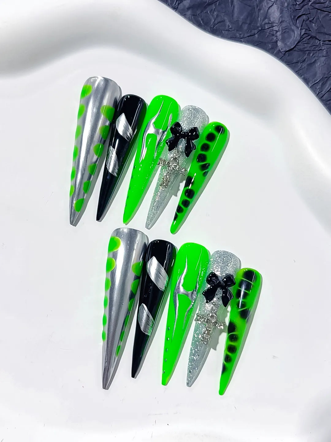 L152 - Long Silver Black Stiletto Abstract Bow Cross