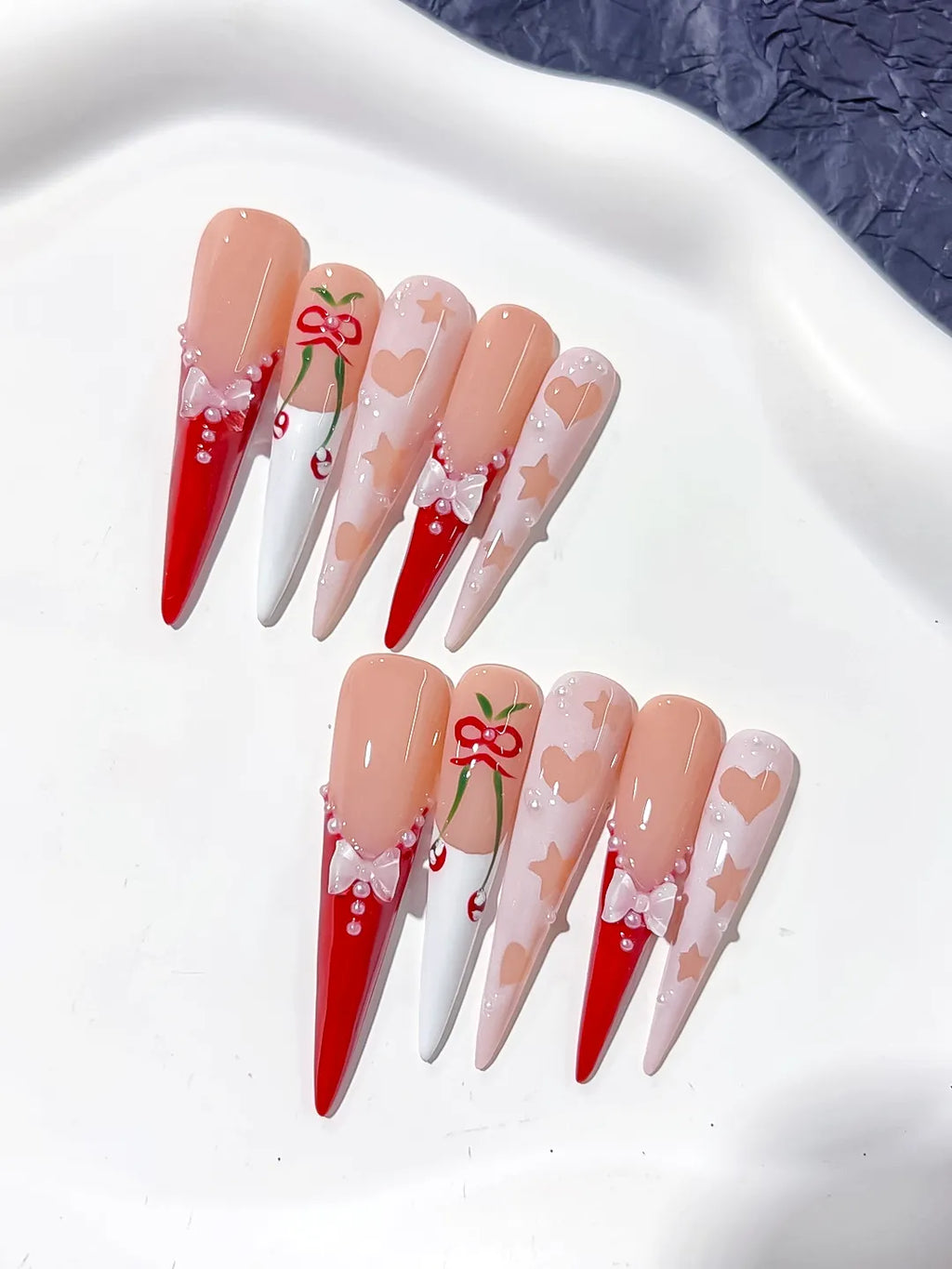 L153 - Long Nude Red Stiletto Abstract Cherry Bow