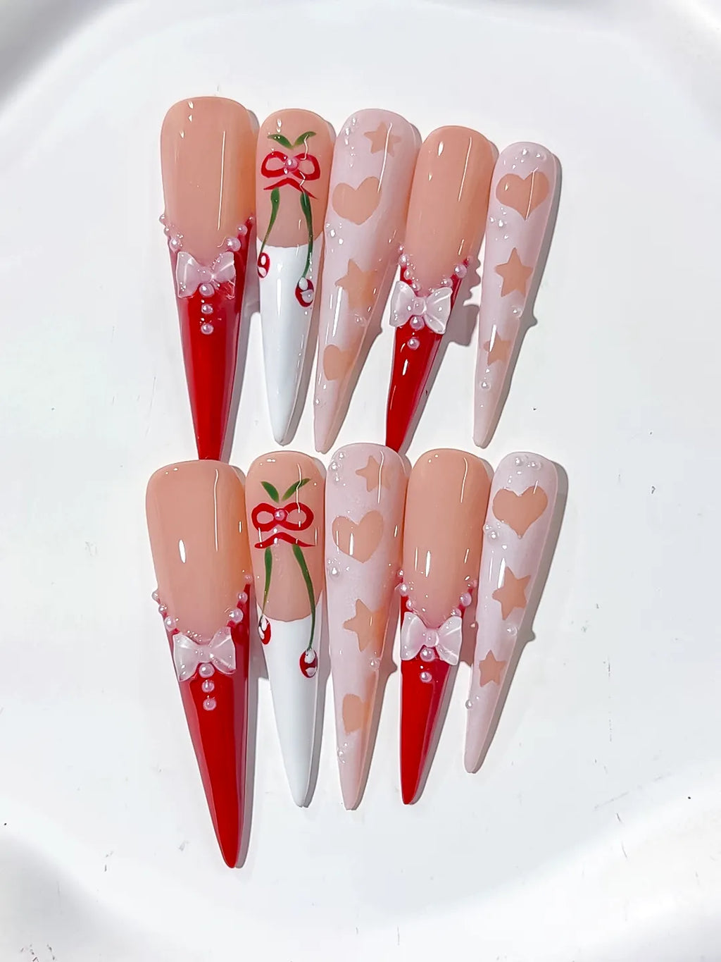 L153 - Long Nude Red Stiletto Abstract Cherry Bow