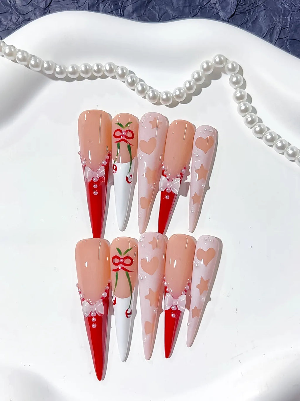 L153 - Long Nude Red Stiletto Abstract Cherry Bow