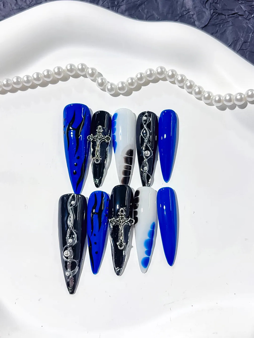 L154 - Long Blue Black Stiletto Abstract Cross Chain