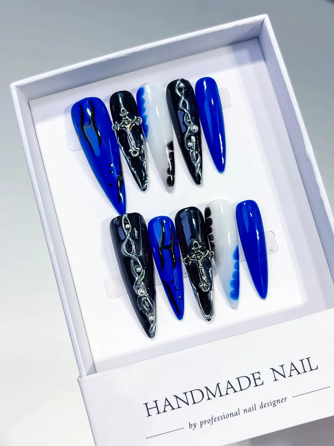 L154 - Long Blue Black Stiletto Abstract Cross Chain
