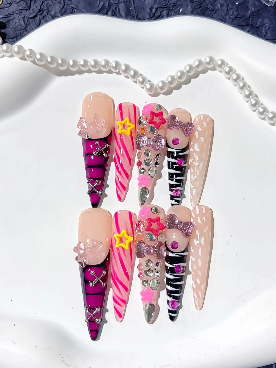 L199 - Long Nude Pink Stiletto Abstract Bow Star